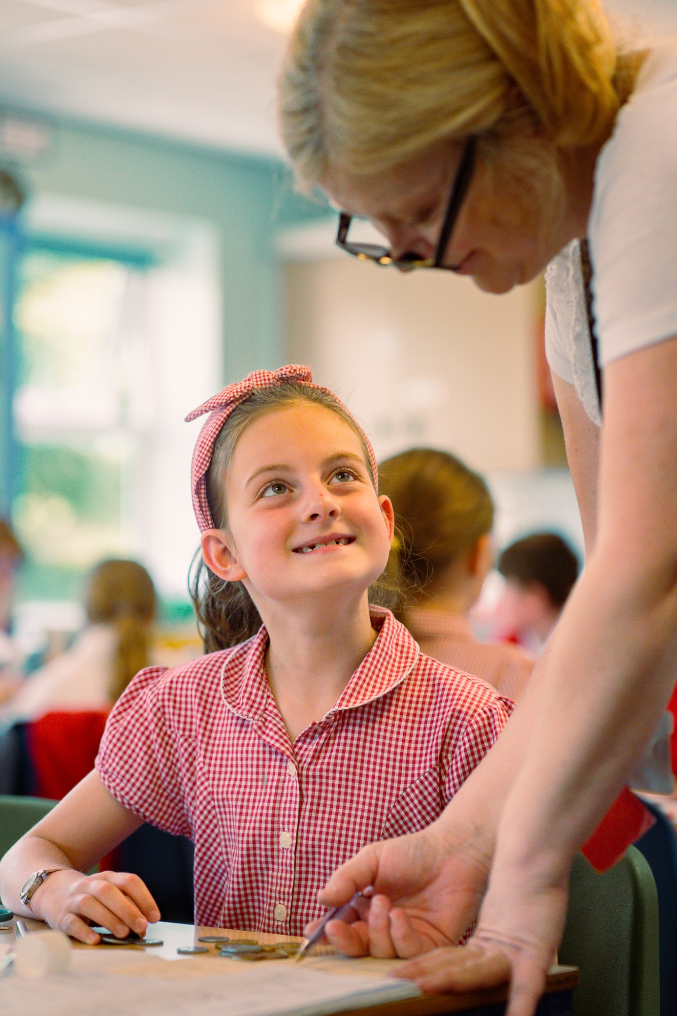 child working with teacher