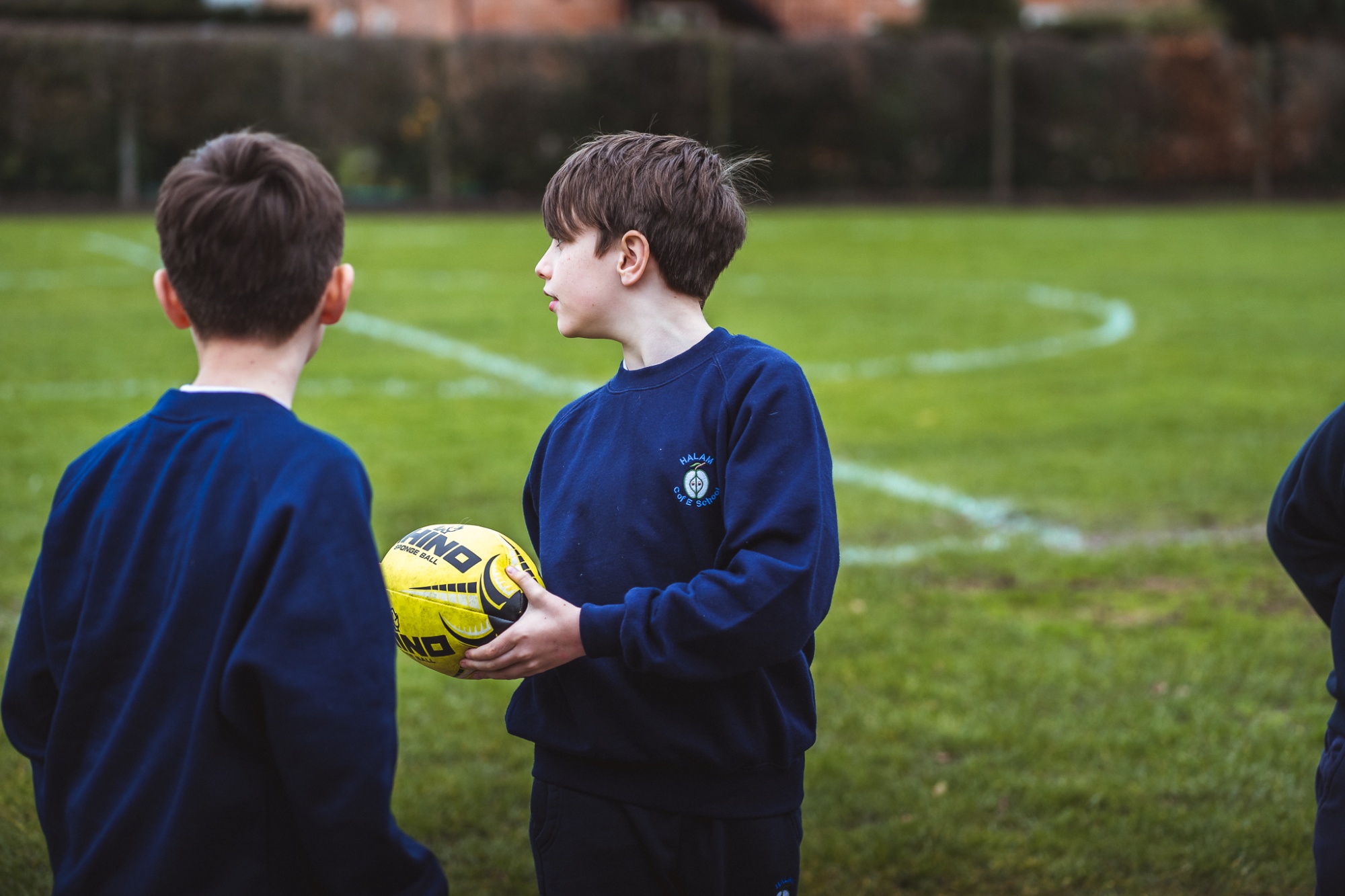 two students playing rugby