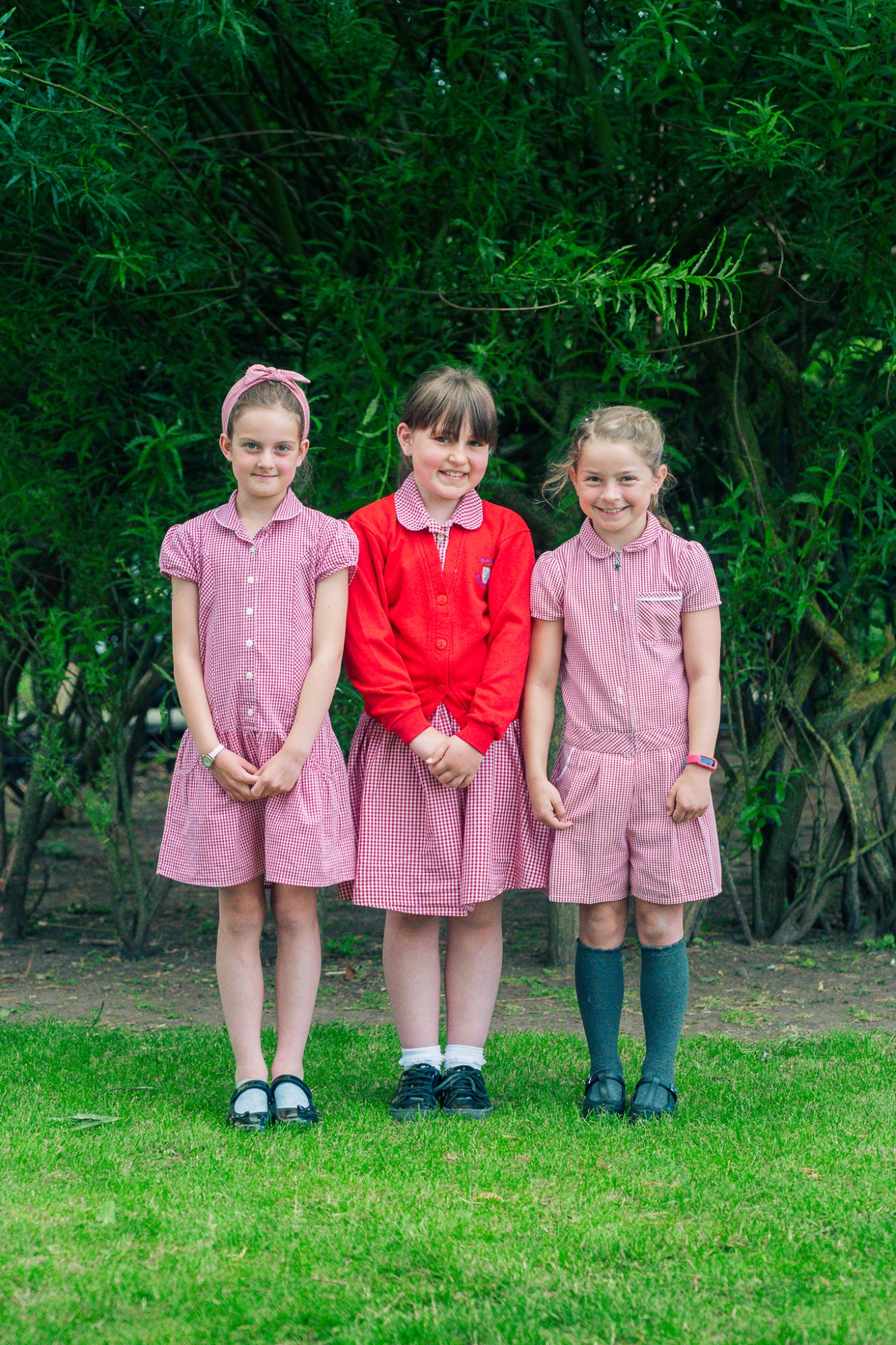 three students in uniform