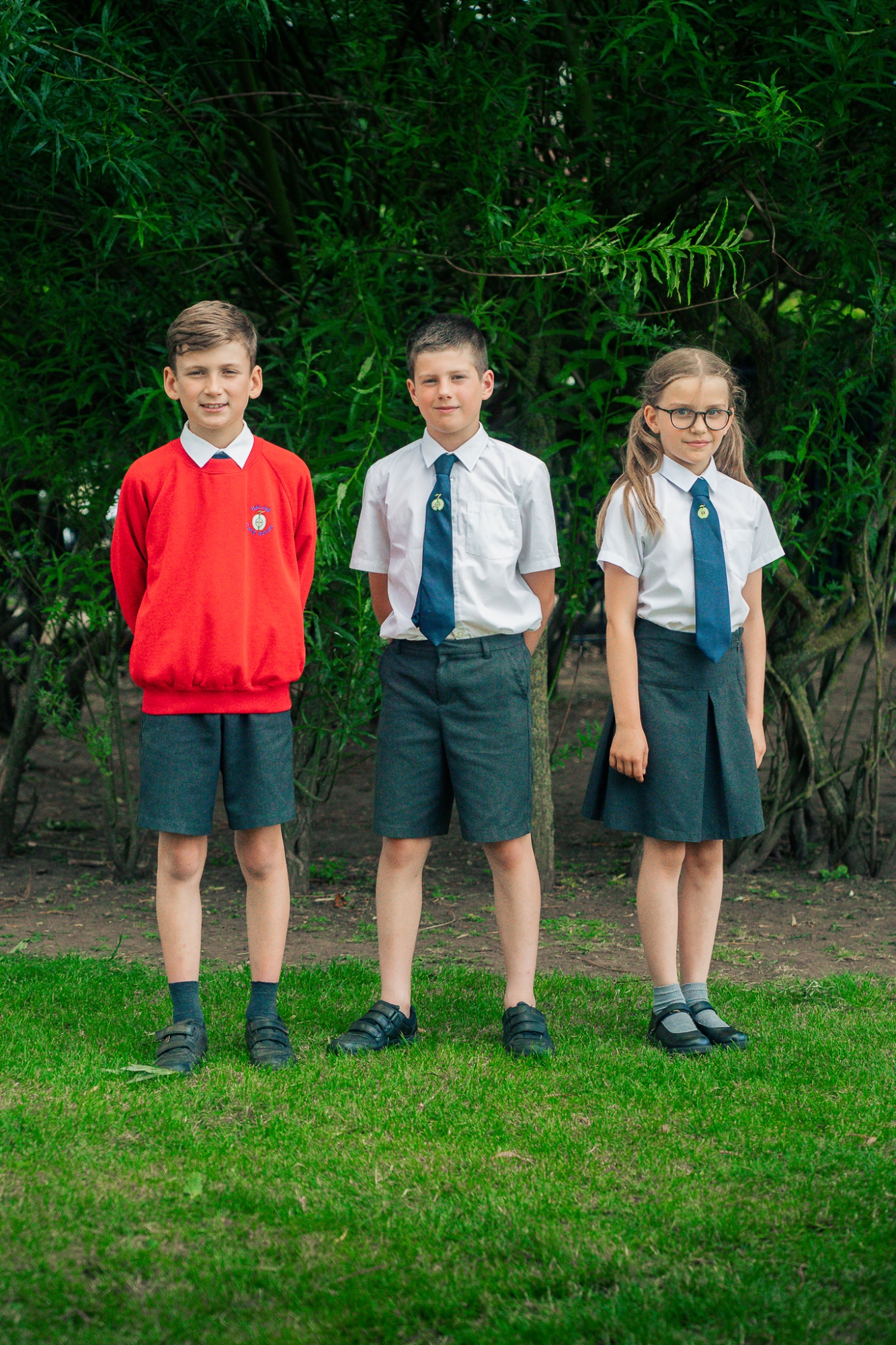 three students in uniform