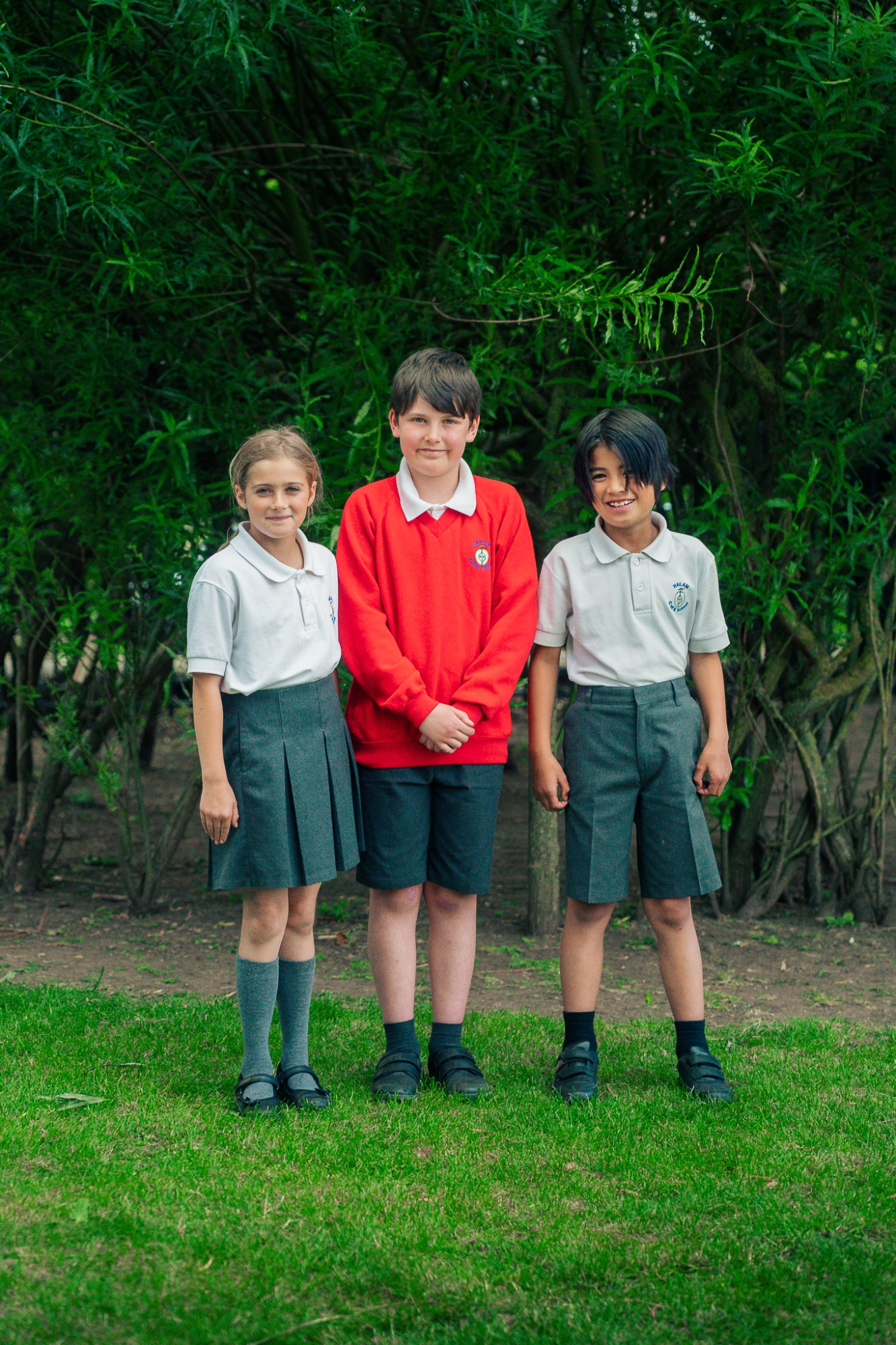 three students in uniform
