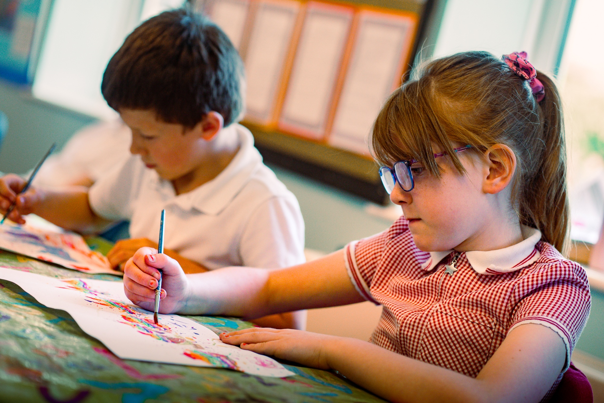 two students painting