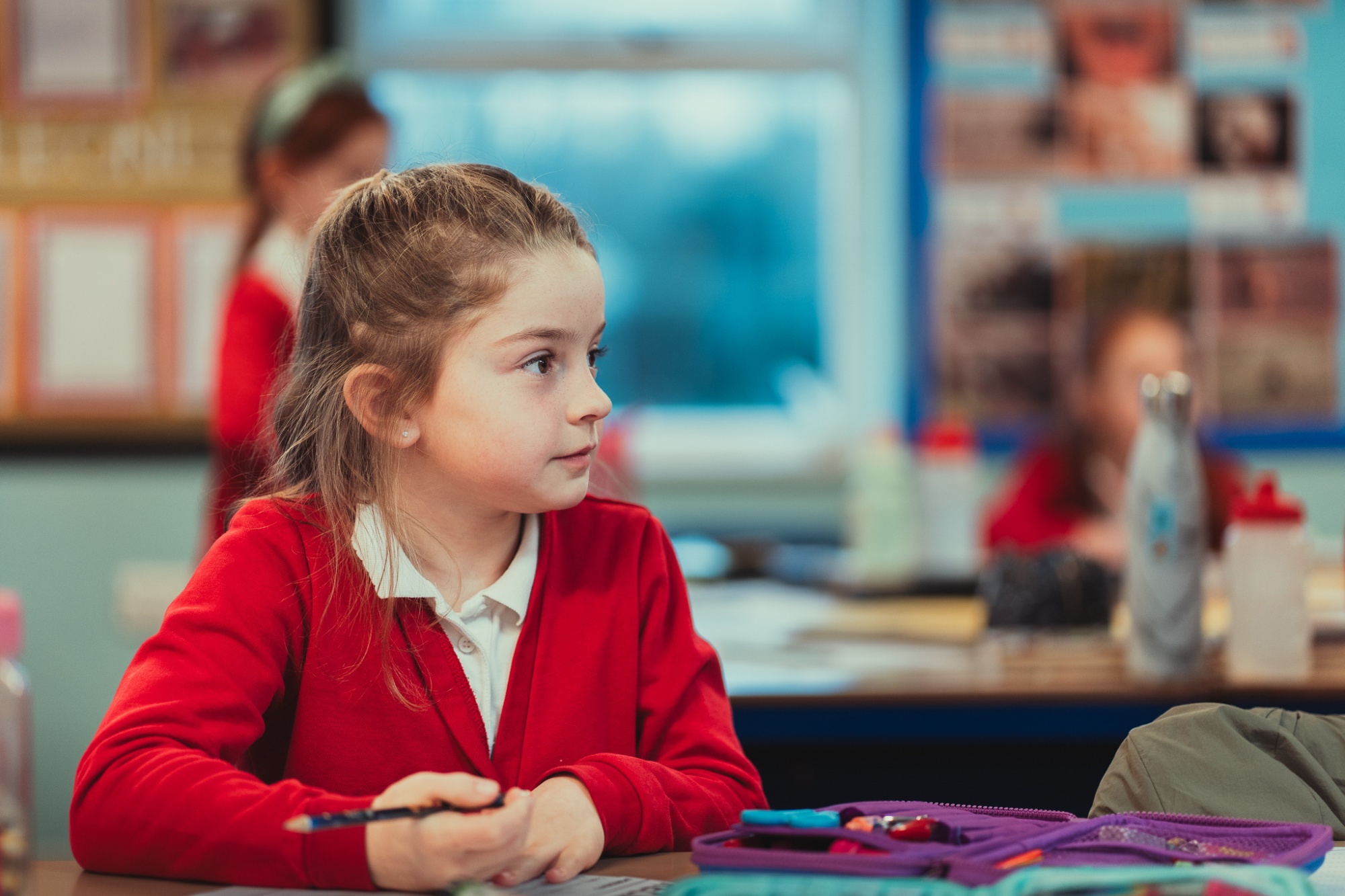 child listening in class