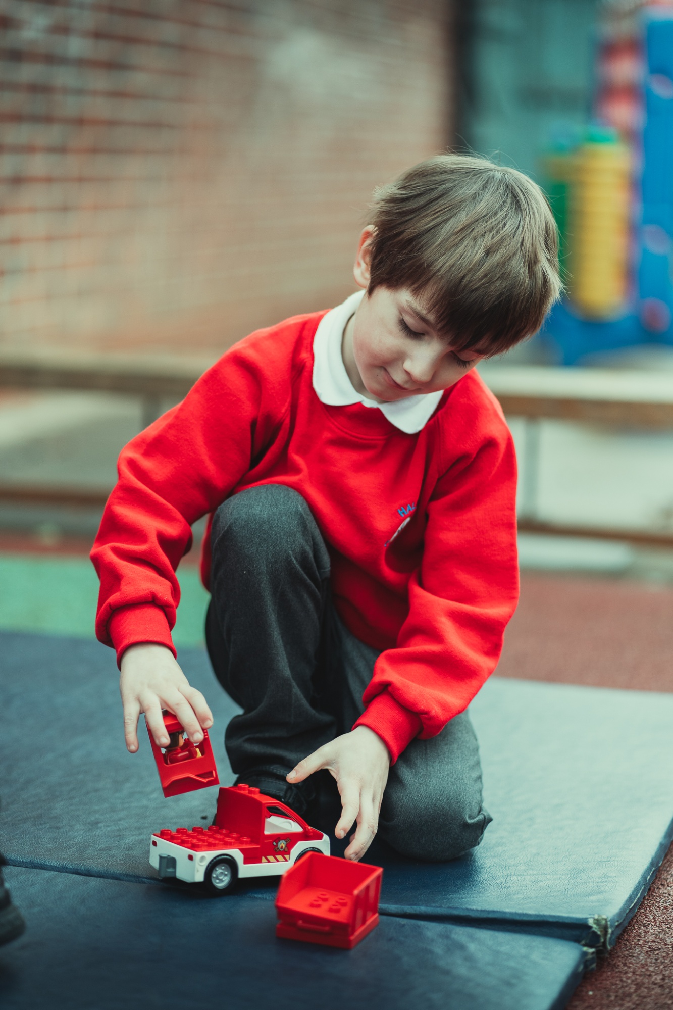 child playing with toy truck